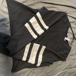 Long sleeve, black with white strips on sleeve. Large, hardly warn.